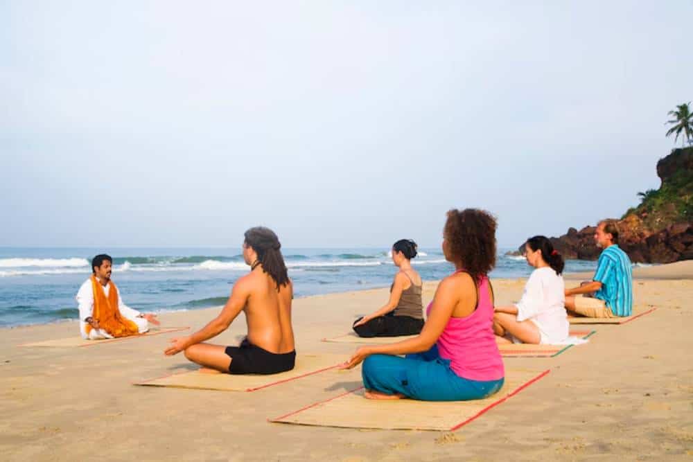 Group therapy session on the beach as part of holistic treatment at a Drug Rehab in Huntington Beach, promoting mental wellness and recovery.