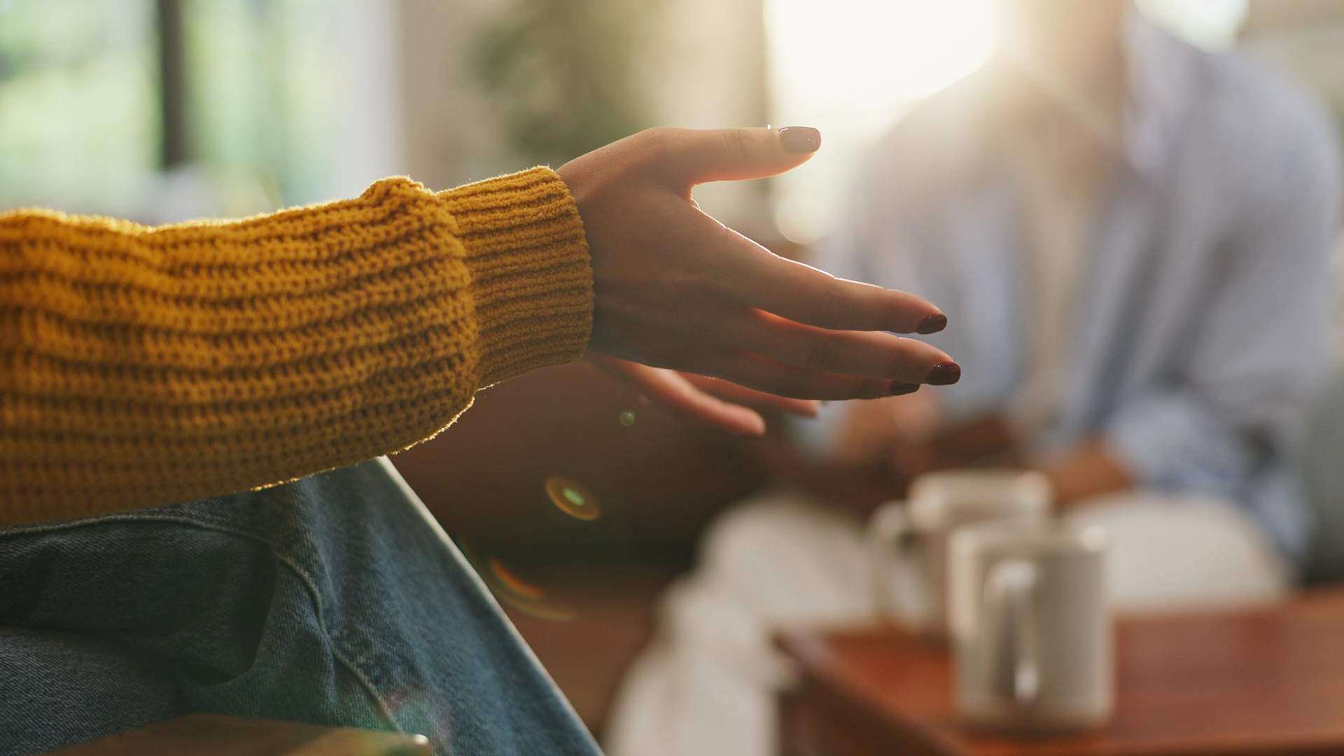 Close-up of a hand symbolizing support and healing through a relapse prevention program in Huntington Beach, CA